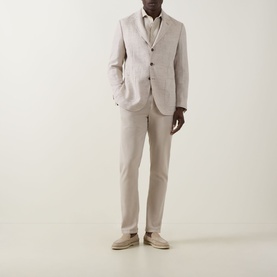 Model wearing Boggi Milano Herringbone Single-Breasted Blazer in sand, styled with matching trousers, white shirt, and beige loafers.