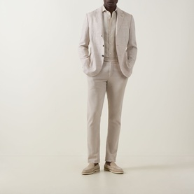 Model wearing Boggi Milano Herringbone Single-Breasted Blazer in sand, styled with matching trousers, white shirt and suede loafers.