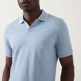 Model wearing Boggi Milano S-Caf&eacute;&reg; Logo Piqu&eacute; Polo Shirt in light blue with white tipped collar detail and short sleeves.