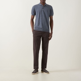 Model wearing Boggi Milano Solid Polo Shirt in indigo, styled with dark brown trousers and grey shoes.