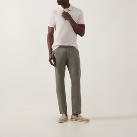 Model wearing Boggi Milano Solid Logo Piqu&eacute; Polo Shirt in Natural, styled with khaki trousers and beige suede loafers.