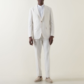 Model wearing Boggi Milano Pure Linen Single-Breasted Suit in cream, styled with a white shirt and beige loafers