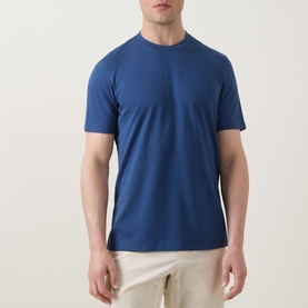 Model wearing Boggi Milano Caf&eacute; Piqu&eacute; Logo T-Shirt in Air Blue, crew neck, short sleeves, styled with beige chinos.