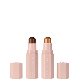 FENTY Mini Match Stix Contour and Highlighter Duo in Ebony and Crown'D, two pink stick compacts with deep brown and gold shimmer tips