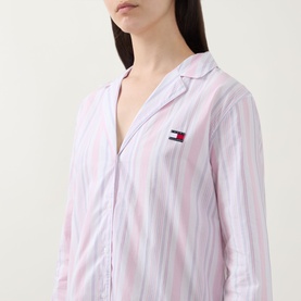 Model wearing Tommy Hilfiger Flag Stripe Night Dress in Classic Pink Multi Stripe, showing notched lapel, long sleeves and embroidered flag logo