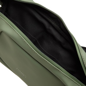 Rains Bum Bag in sage green, open zip showing black interior lining, smooth polyester finish