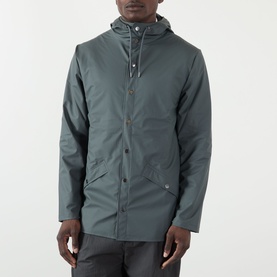 Model wearing Rains casual jacket in Dark Grey, featuring a hood, snap button placket, and front flap pockets