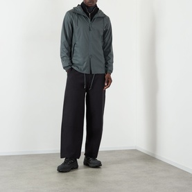 Model wearing Rains Dark Grey Casual Jacket with black wide-leg trousers and black trainers.