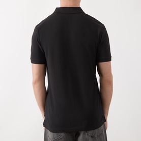 Model wearing Scotch & Soda Logo Piqu&eacute; Polo Shirt in black, rear view, short sleeves, straight hemline, tonal stitching detail