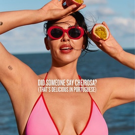 Sol de Janeiro Cheirosa 91 Perfume Mist lifestyle campaign image featuring model in red bikini and sunglasses holding a passion fruit