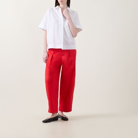 Model wearing InWear Ellin Solid Blouse in white with point collar and short sleeves, styled with red wide-leg trousers and black flats.