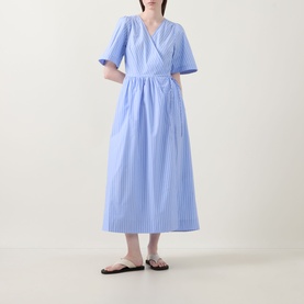 Model wearing InWear Raelynn Striped Wrap Dress in light blue cotton, midi length, V-neckline, short sleeves, flared skirt; styled with black flat