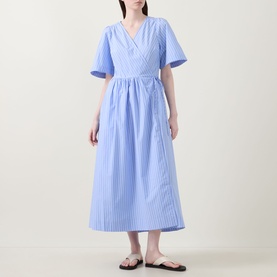Model wearing InWear Raelynn Striped Wrap Dress in light blue cotton, midi length with V-neckline, short sleeves and flared skirt, styled with tan