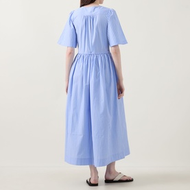 Model wearing InWear Raelynn Striped Wrap Dress in light blue cotton, midi length with short sleeves and flared skirt, back view, styled with black