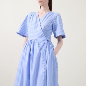 Model wearing InWear Raelynn Striped Wrap Dress in light blue, featuring V-neckline, short sleeves, side tie and flared midi skirt