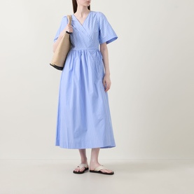 Model wearing InWear Raelynn Striped Wrap Dress in light blue cotton, midi length with V-neckline and short sleeves, styled with black sandals and