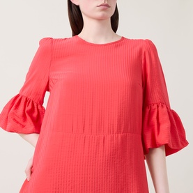 Model wearing InWear Reese Flared Dress in red, featuring round neckline, shadow stripe pattern and flared elbow-length cuffs