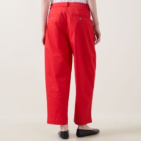 Model wearing InWear Elvia Wide-Leg Cropped Trousers in red, showing rear welt pockets with buttons, styled with black ballet flats
