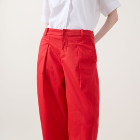 Model wearing InWear Elvia Wide-Leg Cropped Trousers in red, featuring front pleats and high-rise waist, styled with a white shirt.