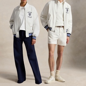 Two models wearing white varsity bomber jackets with navy blue stripe trim and embroidered crest, styled with wide-leg trousers and shorts