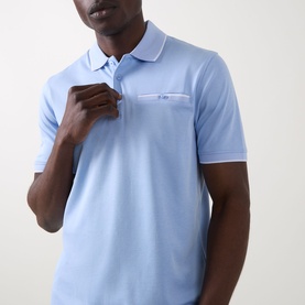Model wearing Bugatti Contrast Tipped Polo Shirt in light blue with white tipped collar, short sleeves, and chest pocket with button fastening.
