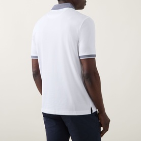 Model wearing Bugatti Contrast Collar Polo Shirt in white, rear view, with grey contrast collar and cuffs, styled with navy trousers.