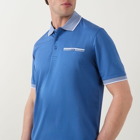 Model wearing Bugatti Tipped Logo Polo Shirt in dark blue with contrast white tipped collar, cuffs, and chest pocket with button fastening.