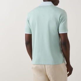 Model wearing Bugatti Patch Pocket Polo Shirt in mint, back view, with white tipped ribbed collar and cuffs, styled with stone chinos.