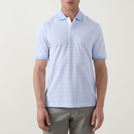 Model wearing Bugatti Stripe Logo Polo Shirt in light blue with white horizontal stripes, flat collar, short sleeves, paired with grey trousers.