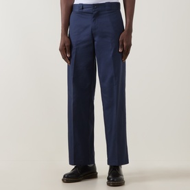 Model wearing Dickies 247 Loose Work Trousers in Navy Blue, straight-leg fit with clean hems, styled with black leather shoes.