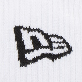New Era Three-Pack Flag Logo Crew Socks in white, close-up of embroidered black flag logo on ribbed cotton fabric