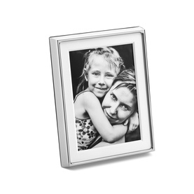 Georg Jensen Deco Picture Frame Large 13x18cm in mirror-polished silver stainless steel, displayed with a black and white family photo.