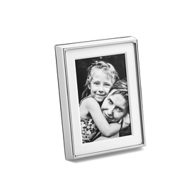 Georg Jensen Deco Picture Frame 10x15cm in mirror-polished silver stainless steel, displayed with a black and white family photo inside.