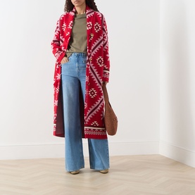 Model wearing Hayley Menzies Sundance Printed Duster Cardigan in red with tapestry motifs, styled with wide-leg jeans and khaki tee.
