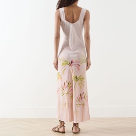 Model wearing Hayley Menzies Palmera Silk Slip Dress in pink with watercolour palm leaf cutwork embroidery, maxi length, back view