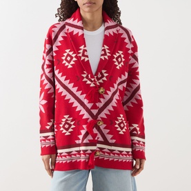 Model wearing Hayley Menzies Sundance Printed Cardigan in red with tapestry-inspired geometric motifs, shawl collar and gold button fastening.