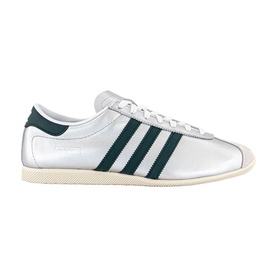 Adidas silver metallic low-top trainer with dark green three stripes, lace-up fastening, and cream rubber cupsole