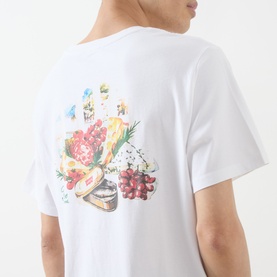 Model wearing Levi's You've Been Served Graphic T-Shirt in white, showing back with colourful food and floral print graphic.