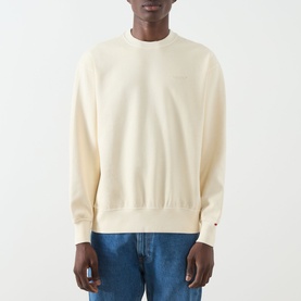 Model wearing Levi's garment dye rutabaga crew neck sweatshirt, styled with blue denim jeans.