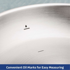 Tramontina silver stainless steel frying pan interior showing engraved oil measuring marks for easy portioning