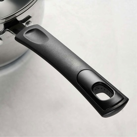 Tramontina silver cookware with close-up of ergonomic black handle featuring oval grip opening
