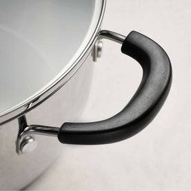 Tramontina silver stainless steel stockpot close-up showing black ergonomic handle and glass lid with steel rim detail.