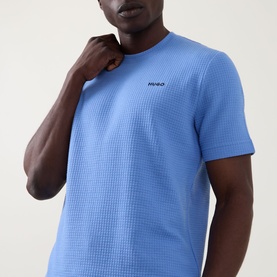 Model wearing Hugo Austin Pyjama T-Shirt in Bright Blue with waffle-knit texture, crew neck, short sleeves and contrast chest logo