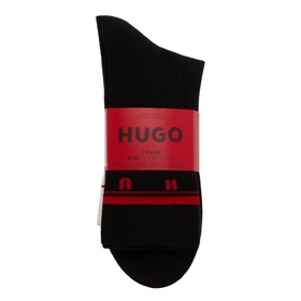 Hugo Three-Pack Spaced Logo Socks in black with red contrast logo cuffs, ribbed finish, shown packaged as a set of three