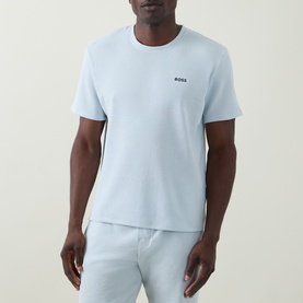 Model wearing Hugo Boss Logo Waffle Texture Lounge T-Shirt in light blue with BOSS chest logo, paired with light blue lounge trousers.