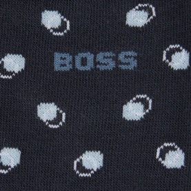 Hugo Boss dark blue cotton socks close-up showing light blue polka dot pattern and woven BOSS logo branding.
