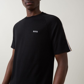 Model wearing Hugo Boss black cotton loungewear T-shirt with contrast stripe sleeve detail and small logo print at chest.