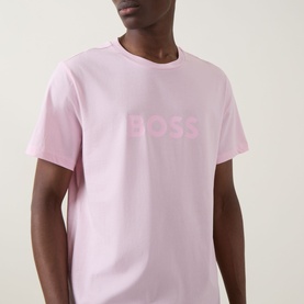 Model wearing Hugo Boss Big Logo T-Shirt in Bright Pink with tonal BOSS chest lettering, crew neckline and short sleeves