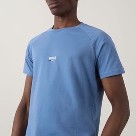 Model wearing Hugo Boss light pastel blue crew neck T-shirt with small chest logo print and raglan sleeves