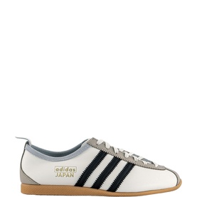 Adidas Japan Trainers in white leather with navy three stripes, gold branding, grey suede heel panel, and gum rubber sole